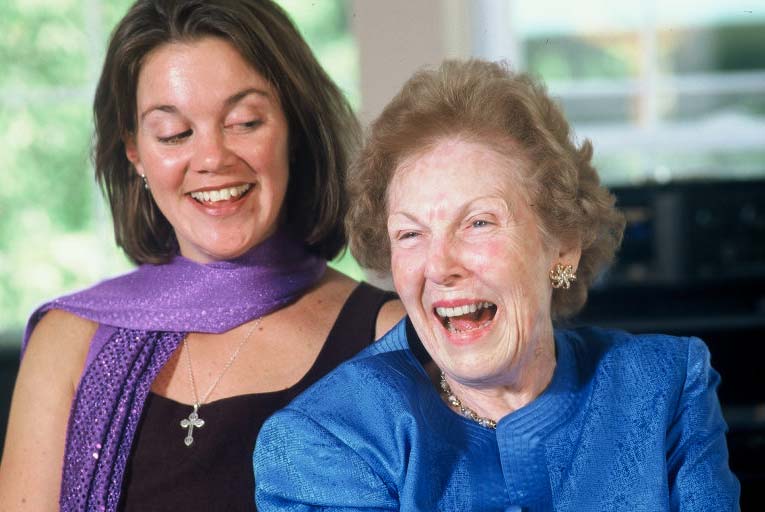 Caregiver comforting resident at Arbor Place, compassionate dementia care in Rockville, MD | Assisted Senior Care in Rockville MD
